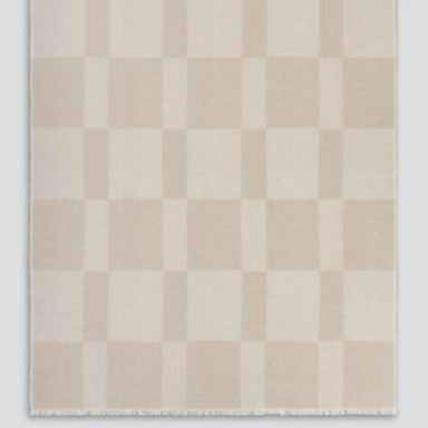 Caramel and ivory Winton throw draped on sofa