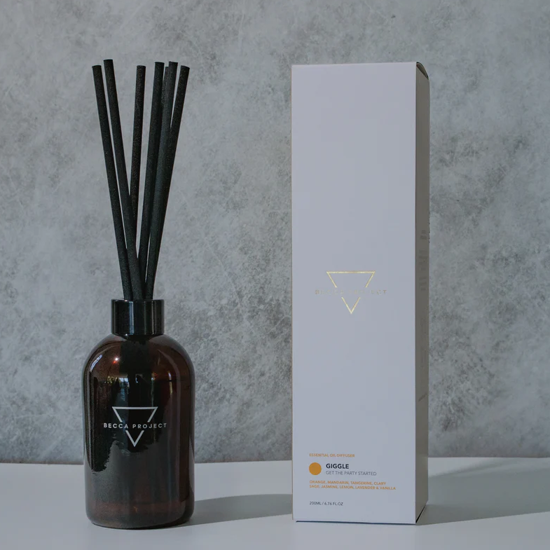 Bottle of Giggle scent blend by BLACK Concept Store