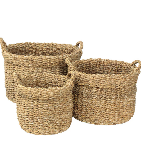 Set of three handmade seagrass baskets with handles, varying sizes