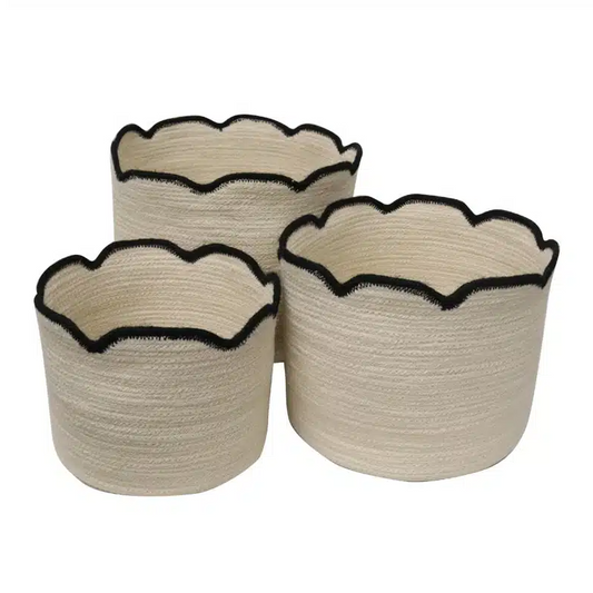 Three beige woven baskets with black rim