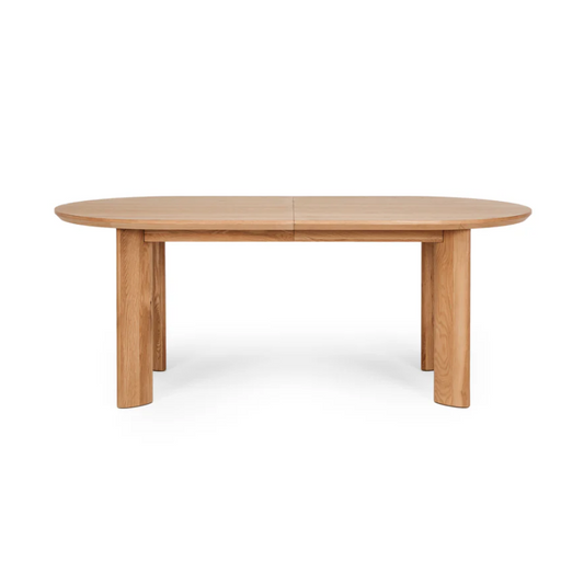 Kontur dining table showing natural wood grain and curved silhouette