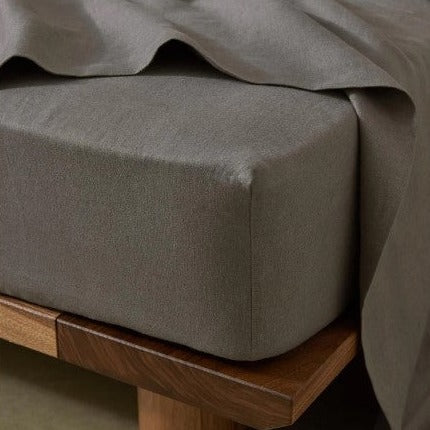 Luxury prewashed linen sheet set in soft charcoal tones