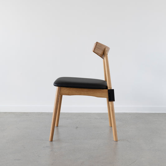 Side view of Wagner dining chair with easy-clean seat.