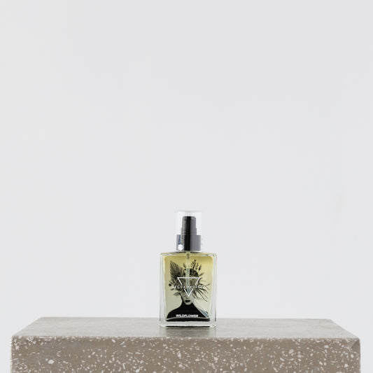 Close-up of Becca Body Oil being applied to skin