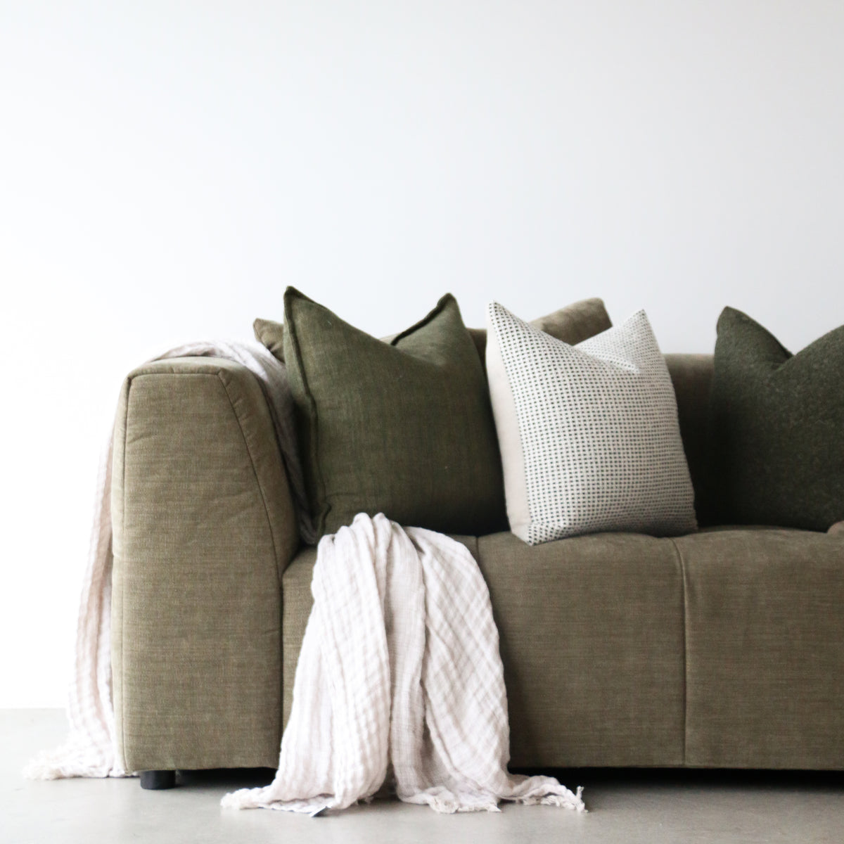 Modern modular sofa with plush cushions and elevated design