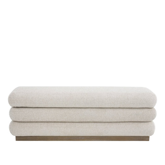 A sculptural upholstered bench with concealed storage, designed for soft comfort and everyday functionality.