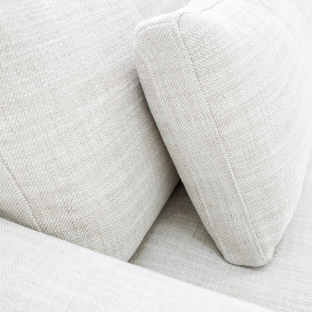 A luxurious modular sofa designed for cloud-like comfort, featuring deep seating, feather-filled cushions, and a flexible five-piece configuration.