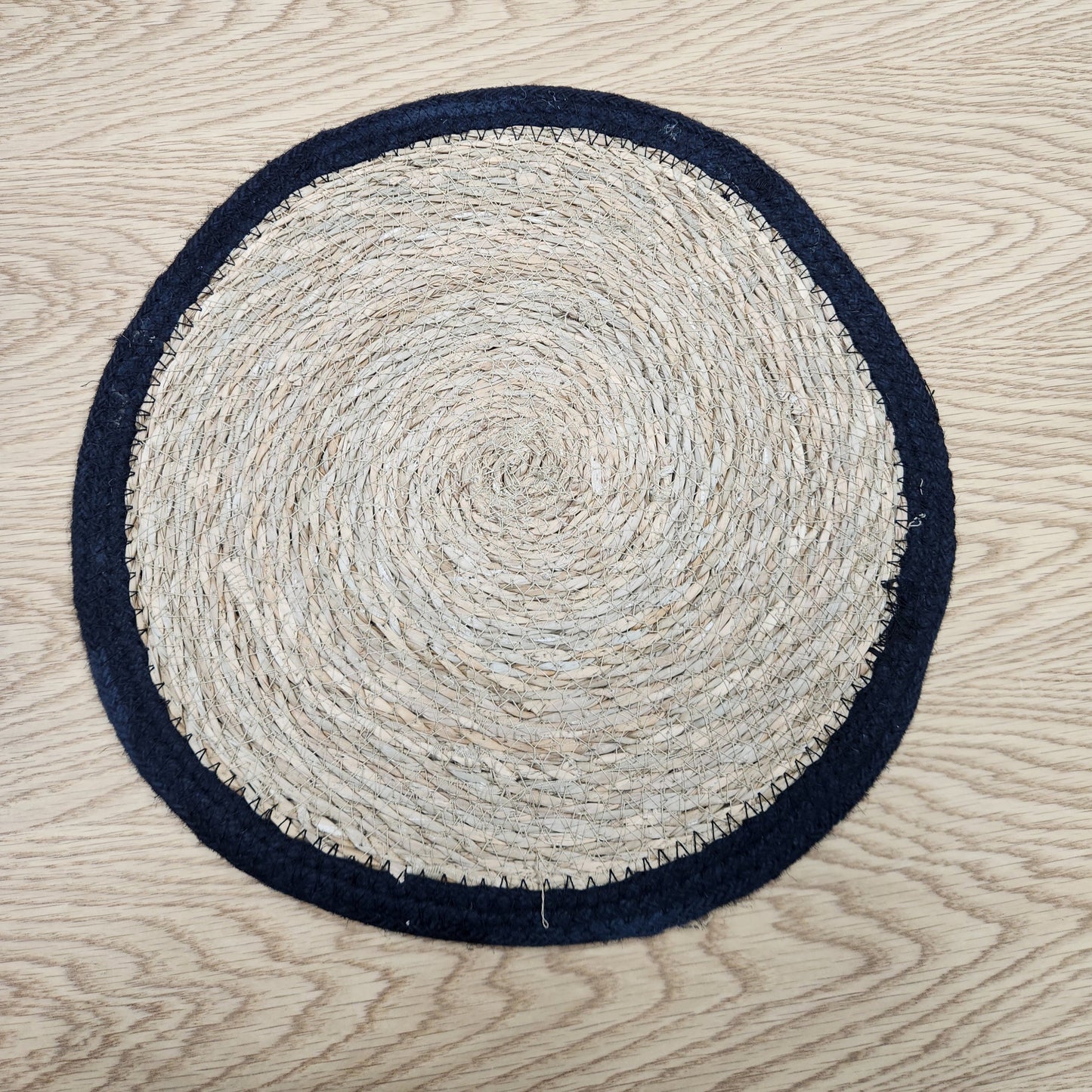 Set of 4 seagrass coasters styled on a dining table