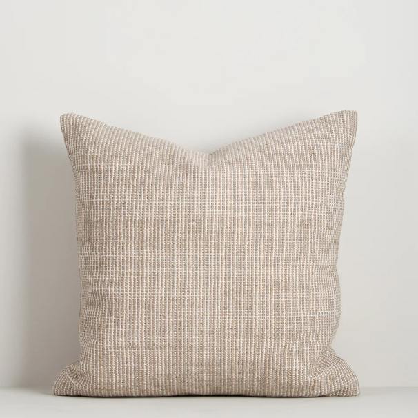 Shop the Baya Dune Outdoor Cushion at Comber and Comber. Handwoven from recycled PET with a textured two-tone design, perfect for stylish outdoor living.