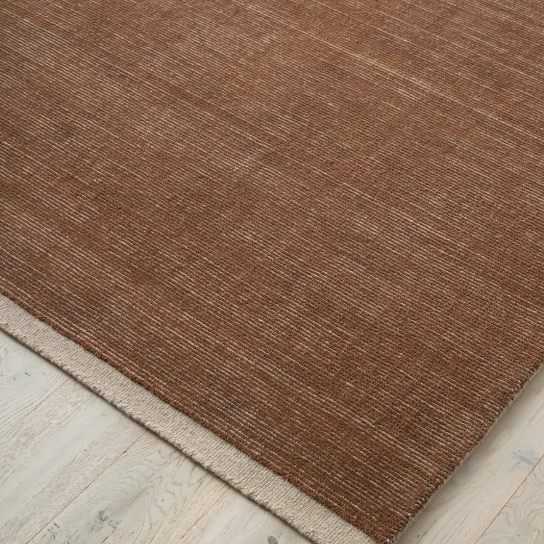 Discover the Remo Rug — 100% New Zealand wool with a high loop horizontal stripe design, cut border, and cotton backing. Available in 4 colours, ideal for contemporary living.