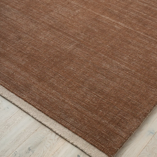 Discover the Remo Rug — 100% New Zealand wool with a high loop horizontal stripe design, cut border, and cotton backing. Available in 4 colours, ideal for contemporary living.