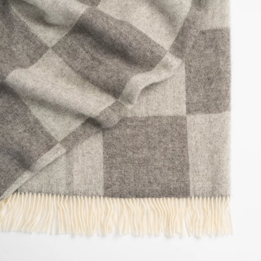 Shop the Lake Hayes wool throw 140x240cm – a soft, 100% New Zealand wool throw with a classic brown-and-cream check design, cosy warmth, and elegant gift-ready presentation.