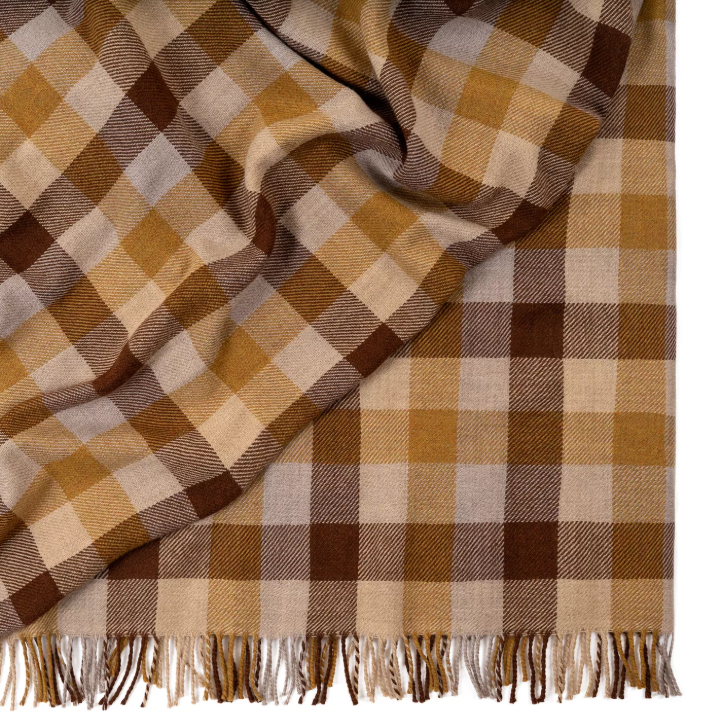 Shop the Caldwell Merino lambswool throw 145x200cm – lightweight, soft, and warm with a timeless plaid design, perfect for year-round comfort and gifting.