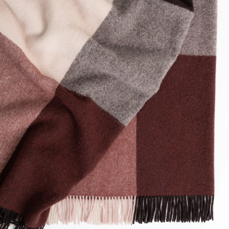 Shop the Brookside wool throw 140x240cm – a thick, 100% wool throw in a modern beetroot, chocolate, and soft pink large check design, perfect for warmth, style, and gift-giving.