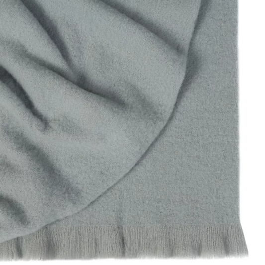 Shop the Hyde wool blend throw 130x200cm – New Zealand made with plush brushed texture and tassel fringe, soft, tactile, and perfect for gifting.