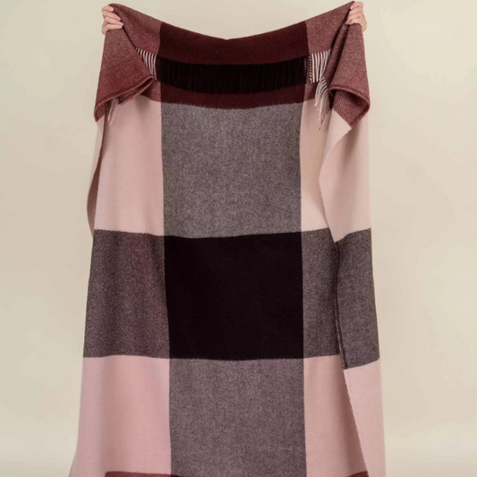 Shop the Brookside wool throw 140x240cm – a thick, 100% wool throw in a modern beetroot, chocolate, and soft pink large check design, perfect for warmth, style, and gift-giving.