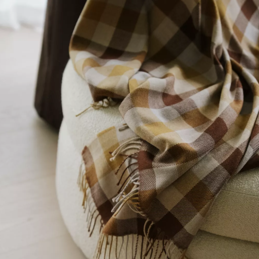 Shop the Caldwell Merino lambswool throw 145x200cm – lightweight, soft, and warm with a timeless plaid design, perfect for year-round comfort and gifting.