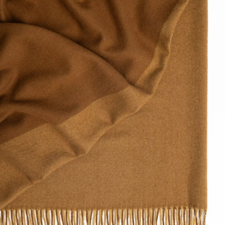 Shop the Fiord wool throw 130x190cm – lightweight, 100% wool with a contemporary Biscuit and Caramel two-tone panel design, perfect for warmth, style, and gifting.