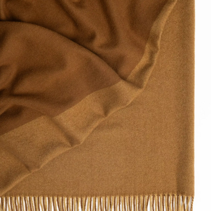 Shop the Fiord wool throw 130x190cm – lightweight, 100% wool with a contemporary Biscuit and Caramel two-tone panel design, perfect for warmth, style, and gifting.