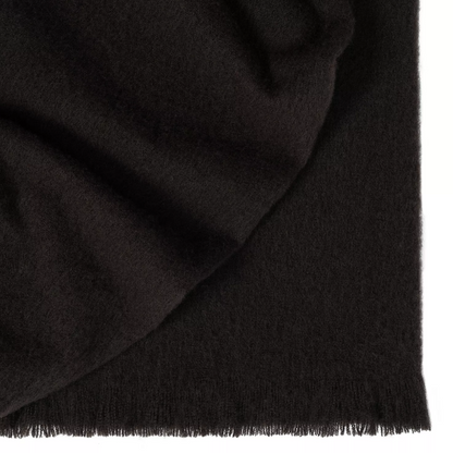 Shop the Hyde wool blend throw 130x200cm – New Zealand made with plush brushed texture and tassel fringe, soft, tactile, and perfect for gifting.