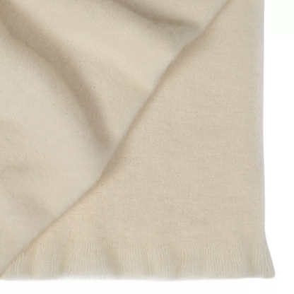Shop the Hyde wool blend throw 130x200cm – New Zealand made with plush brushed texture and tassel fringe, soft, tactile, and perfect for gifting.