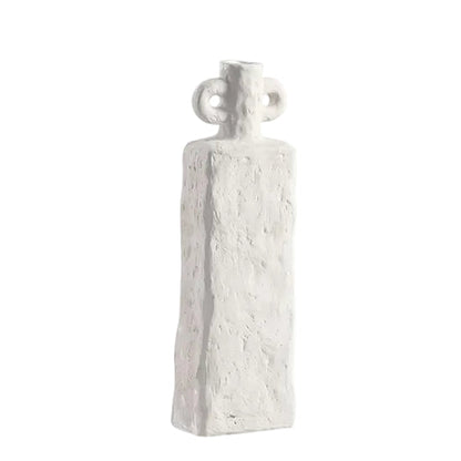 A modern sculptural accent, the Lunar Handle Vase – Small features a distinctive curved handle and minimalist form, perfect for styling with simple stems or displaying as a decorative object.