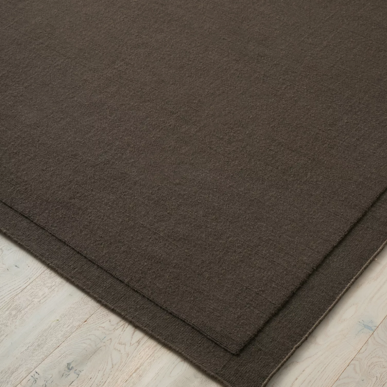 Shop the Cassio Rug — 100% New Zealand wool loop pile with textured finish, serged edge, and durable cotton backing. Available in 4 colours and 2 sizes, perfect for modern living.
