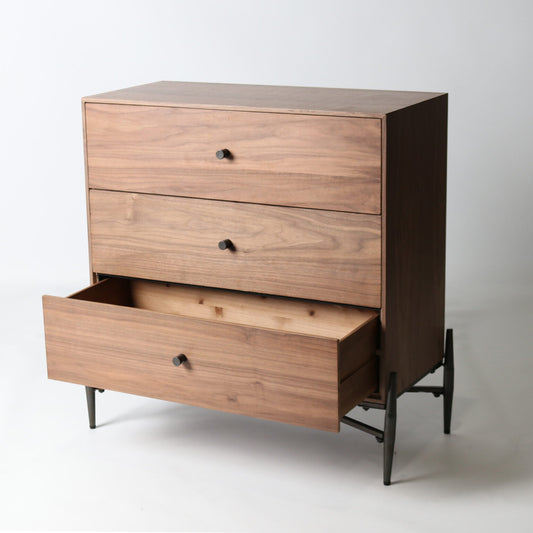 A compact, contemporary commode in a warm walnut finish, combining practical storage with a sleek, modern silhouette.