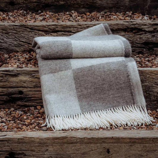 Shop the Lake Hayes wool throw 140x240cm – a soft, 100% New Zealand wool throw with a classic brown-and-cream check design, cosy warmth, and elegant gift-ready presentation.