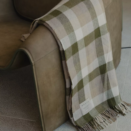Shop the Caldwell Merino lambswool throw 145x200cm – lightweight, soft, and warm with a timeless plaid design, perfect for year-round comfort and gifting.