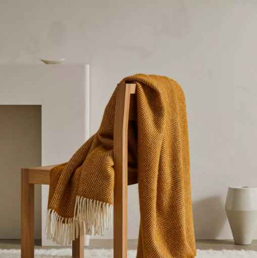 Shop the Magnus wool throw 150x183cm – a thick, 100% New Zealand wool throw with classic herringbone weave and fringe, perfect for cosy living and gifting.