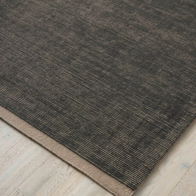 Discover the Remo Rug — 100% New Zealand wool with a high loop horizontal stripe design, cut border, and cotton backing. Available in 4 colours, ideal for contemporary living.