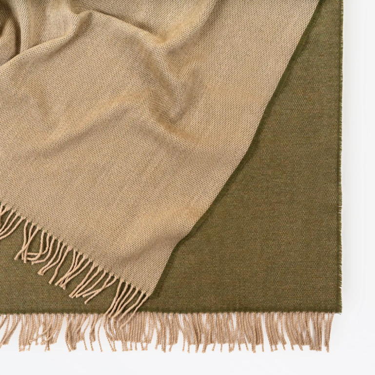 Shop the Harris Merino lambswool throw 145x200cm – reversible, lightweight, and soft with refined texture, perfect for year-round comfort and gifting.