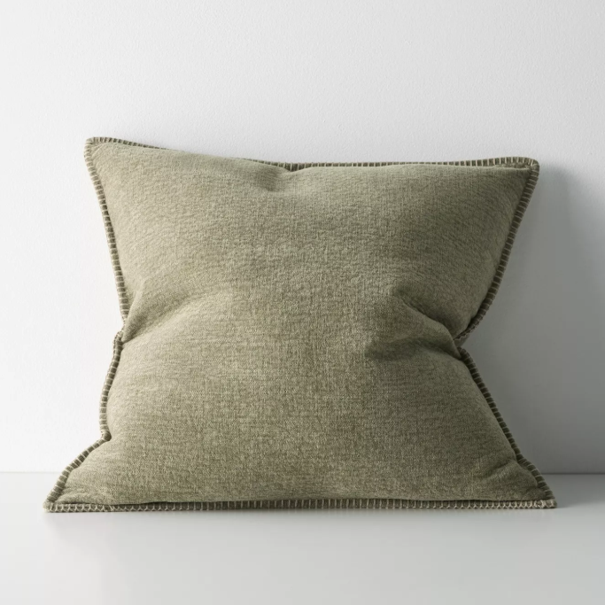 The Alba 50x50cm cushion features a soft linen-poly blend with a subtle two-tone weave and blanket stitch edging, offering relaxed texture and timeless versatility.