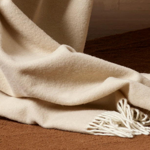 Olive-toned wool throw for traditional or contemporary interiors