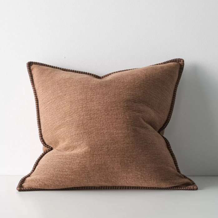 The Alba 50x50cm cushion features a soft linen-poly blend with a subtle two-tone weave and blanket stitch edging, offering relaxed texture and timeless versatility.