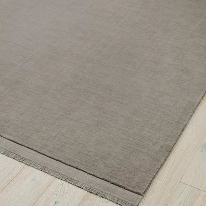 Light grey rug on a light wood floor. 2x3m 3x4m. 100% NZ wool