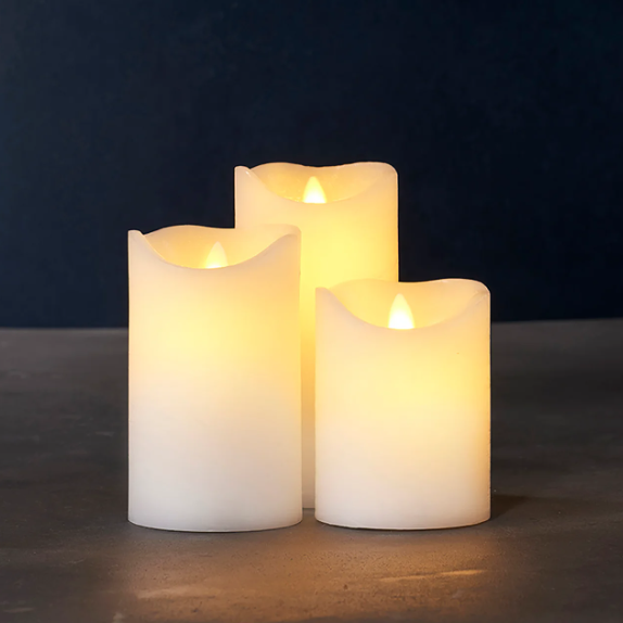 Three flameless candles with a warm glow LED Battery operated