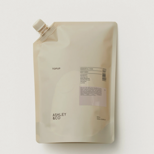 An Ashley & Co. Topup pouch of body wash in 'Soft Sand' color, shown on a clean white background with a soft shadow.
