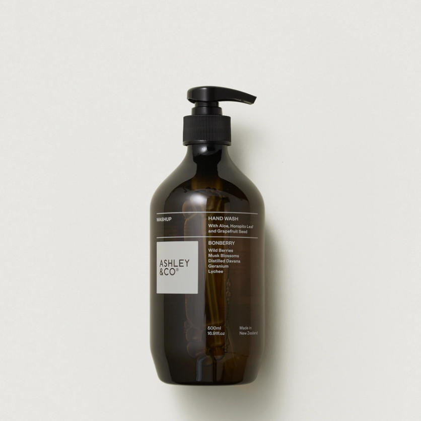 Ashley & Co hand wash in an amber glass bottle with a black pump dispenser, shown against a plain off-white background.