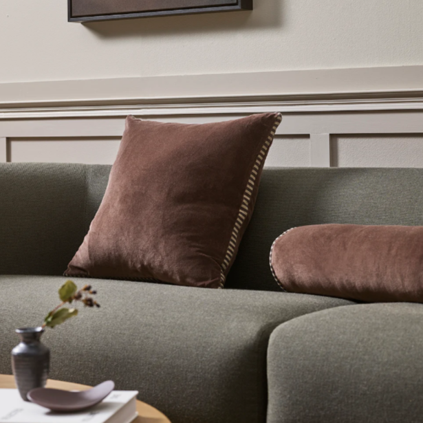 Box-style Edward Cushion adding structure to a neutral sofa