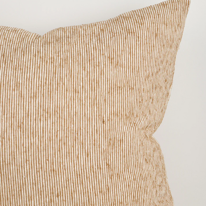 A beautifully textured cotton cushion featuring a subtle pinstripe weave and earthy colour palette, designed to bring warmth, depth, and effortless layering to contemporary interiors.