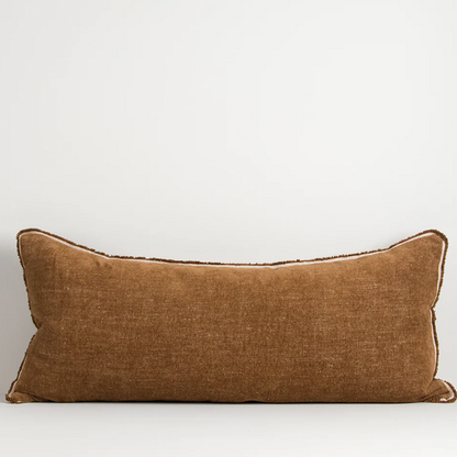 A luxurious cotton-linen chenille lodge cushion featuring a soft velvety texture, refined border detailing, and rich earthy colourways designed to bring warmth, comfort, and sophistication to contemporary interiors.