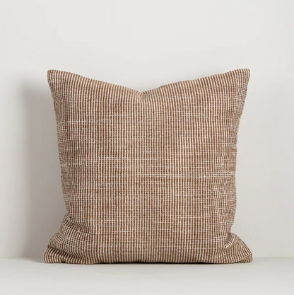 Shop the Baya Dune Outdoor Cushion at Comber and Comber. Handwoven from recycled PET with a textured two-tone design, perfect for stylish outdoor living.