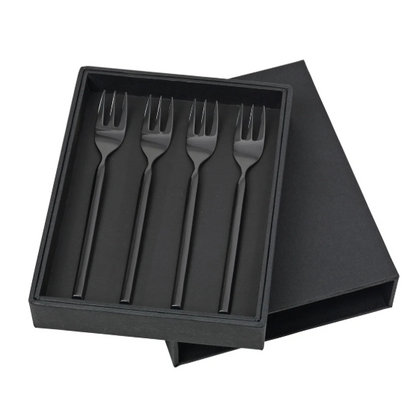 Set of four black forks in a black box